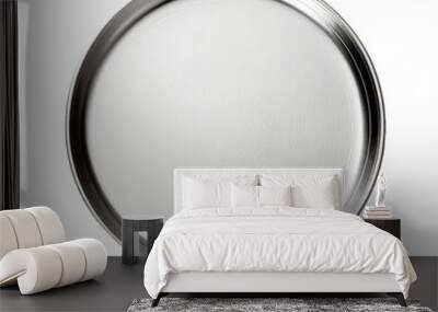 An empty, silver pizza pan sits on a white background, photographed from directly above Wall mural