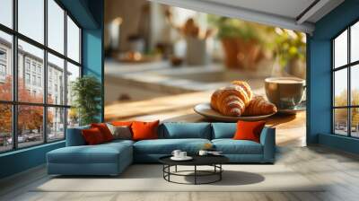 Coffee cup and fresh baked croissant on a plate on a wooden table for french breakfast in the morning on a balcony Wall mural