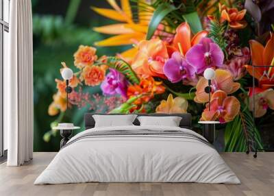 A close-up image of a vibrant tropical flower arrangement featuring orchids, lilies, and other colorful blooms. The bouquet is arranged in a vase and showcases the beauty of natures vibrant hues. Wall mural