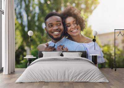 African-american couple in love hugging in park Wall mural