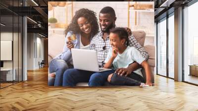 African american family shopping online with laptop and credit card Wall mural