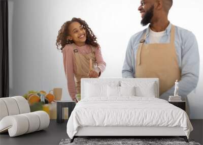 African american father and daughter cooking tasty fresh salad Wall mural