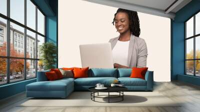 African American Girl Working On Laptop Sitting Over White Background Wall mural