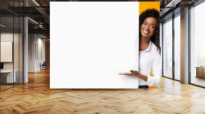 African-american man pointing at white blank board Wall mural