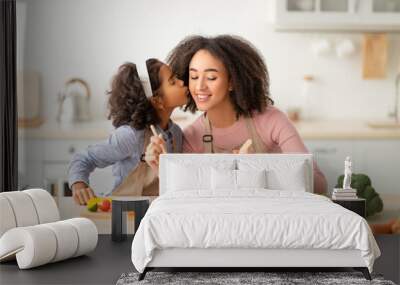 African american mother and daughter cooking vegan salad Wall mural