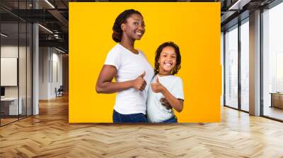 Afro family smiling and gesturing thumbs up Wall mural