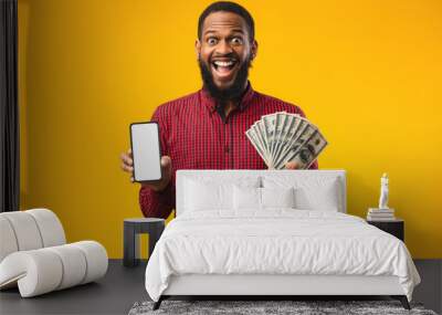 Afro guy holding mobile phone and bunch of money Wall mural