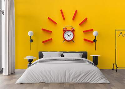 Alarm clock with red dominoes on yellow background Wall mural