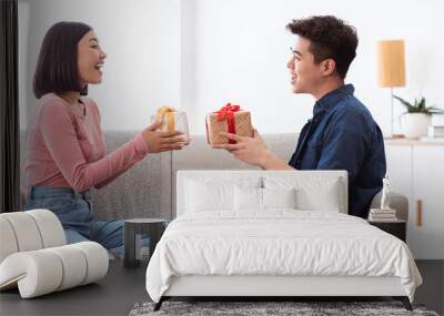 Asian Couple Exchanging Gifts Celebrating Family Holiday At Home, Panorama Wall mural