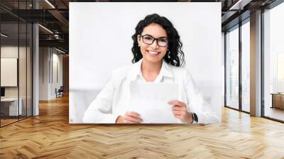 Attractive recruiter holding documents, looking at camera Wall mural