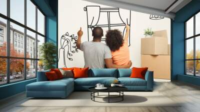 Back view of African American couple daydreaming about their new home, collage with illustrations on white wall Wall mural