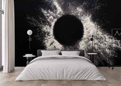 baking concept on black background, sprinkled flour circle with copy space Wall mural