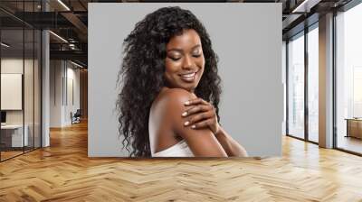 beautiful afro girl touching her soft skin on body Wall mural