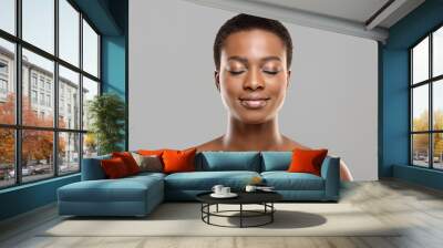 Beautiful afro woman with closed eyes, natural makeup and perfect skin Wall mural