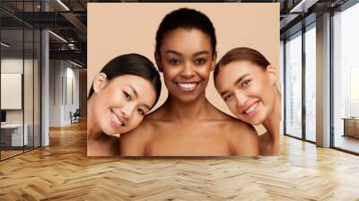 Beauty Of Body. Three Multiracial Women Wrapped In Towels Posing Smiling To Camera Standing On Gray Background Wall mural