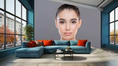 Beauty portrait of young woman with clean and healthy skin Wall mural