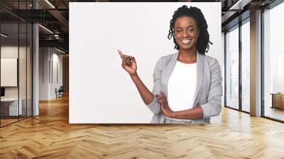 Black Business Lady Pointing Finger At Empty Space On White Wall mural