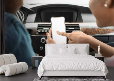 Black man and woman using mobile phone in car, mockup Wall mural