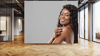 Black Woman With Natural Makeup and White Teeth On Grey Background Wall mural