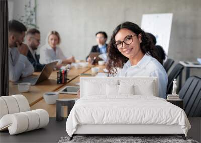 Businesswoman Taking Notes Smiling To Camera At Corporate Meeting Indoor Wall mural