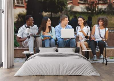 Campus Life. Cheerful college students resting outdoors between classes Wall mural