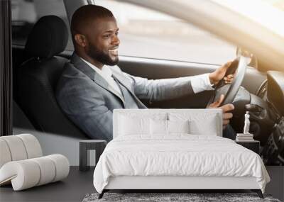 Cheerful african american businessman driving to work Wall mural