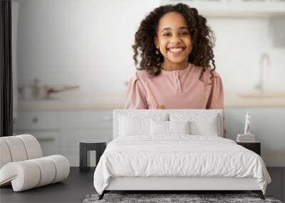 Cheerful african american girl preparing healthy salad Wall mural