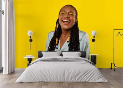 Cheerful African American Lady Laughing Out Loud Over Yellow Background Wall mural