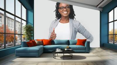 Cheerful Black Businesswoman Gesturing Thumbs-Up, On White Background In Studio Wall mural