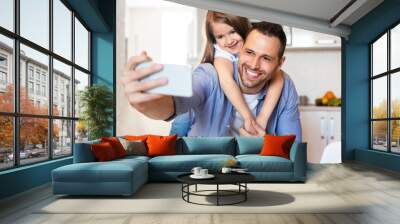 Cheerful Dad And Daughter Making Selfie Having Fun In Kitchen Wall mural