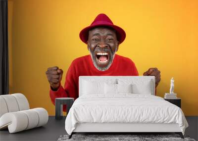 Cheerful excited old black man in hat, with open mouth, scream, rise fists, celebrate win Wall mural