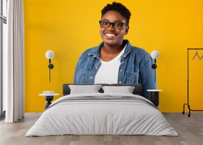 Cheerful Overweight African American Lady Posing Over Yellow Background Wall mural