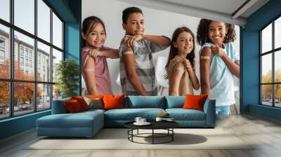 Cheerful Vaccinated Kids Showing Arms After Covid-19 Vaccination Posing Indoors Wall mural