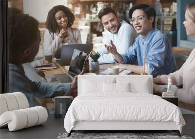 Close up of young people having business meeting in office Wall mural