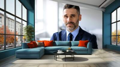 Closeup portrait of bearded middle aged businessman posing at office, man manager in suit and tie looking at camera Wall mural