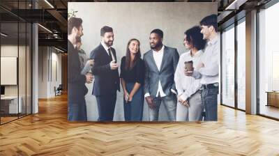 Coffee break chat. Business people talking in office Wall mural