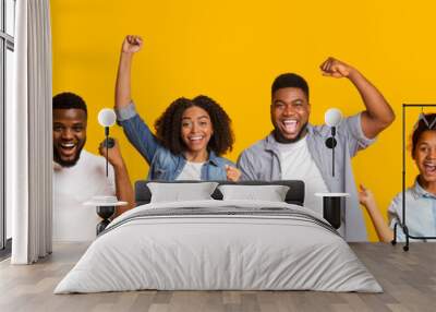 Collage of happy black people celebrating success on yellow Wall mural