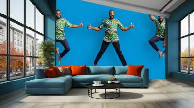 Collage of jumping black guy in traditional african costume Wall mural