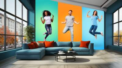 Collection of positive multiracial young people jumping on studio backgrounds Wall mural