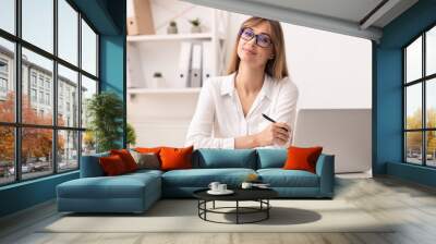 Confident Businesswoman Smiling At Camera Sitting In Modern Office Wall mural