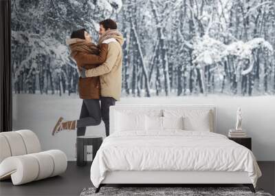 Couple Embracing Standing In Snowy Winter Forest In The Morning Wall mural