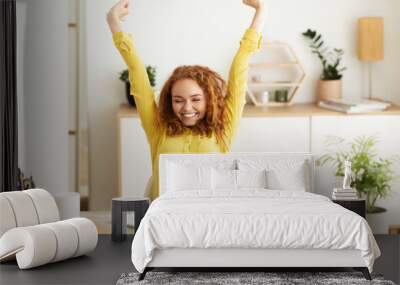 Creative Designer Stretching In Front Of Laptop Computer Wall mural