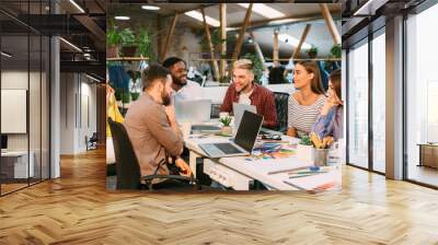 Creative start-up team discussing ideas in modern office Wall mural