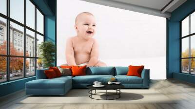 Cute baby sitting on white background, copy space Wall mural