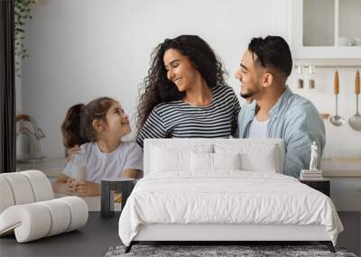 Cute happy family having breakfast while spending weekend at home Wall mural