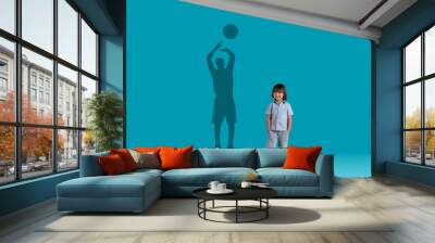 Cute little boy and shadow of adult basketball player behind Wall mural