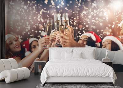 Diverse friends clinking with champagne glasses on New Year's Eve Wall mural