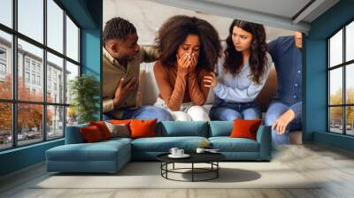 Diverse friends providing support to unhappy crying black lady indoor Wall mural