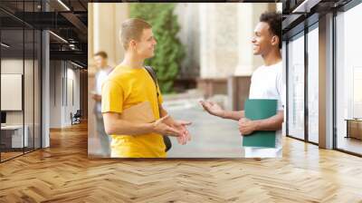 Diverse friends talking, having break in university campus Wall mural