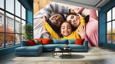 Family evening multiracial family. Daughter hugging parents Wall mural